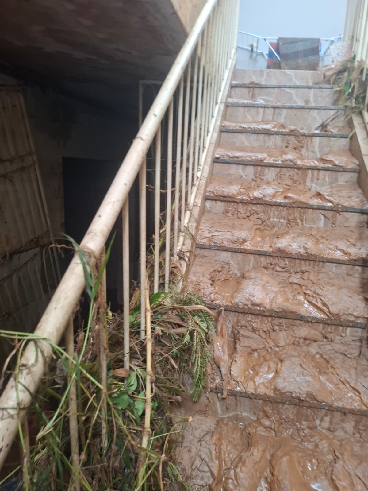 Staircase completely coated in mud at the church building